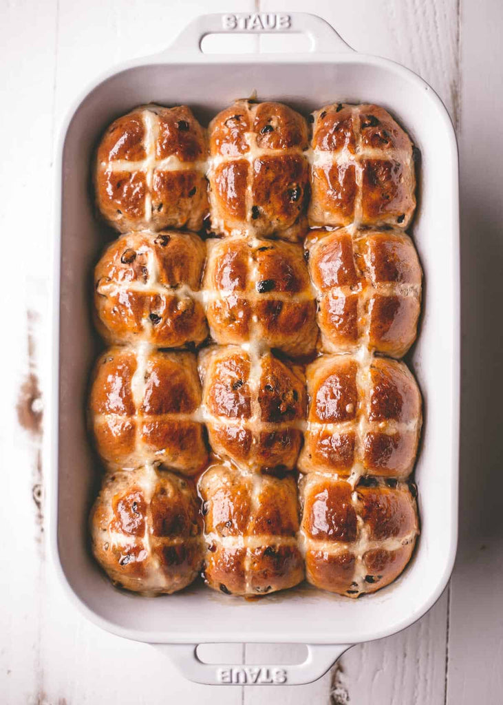 Light and fluffy, these Hot Cross Buns are slightly sweet, filled with spices, and make a perfect Good Friday or Easter bread.