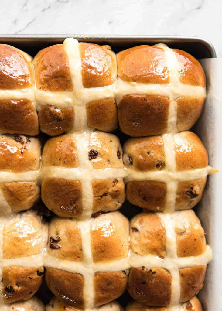 Fluffy, fragrant, homemade Hot Cross Buns recipe! With a short recipe video and some cheeky but effective tips, I think you’ll be amazed how easy it is to make hot cross buns.
