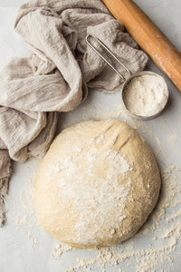 Making your own whole wheat pizza dough from scratch is easier than you think! A mix of flours, olive oil, and a touch of maple will give you the perfect crispy, tender, and flavorful crust that works with just about any pizza recipe.